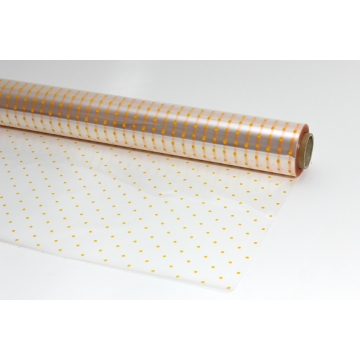 Transparentní dekorový celofán na roli se žlutým puntíkovým vzorem, 30 mikronů.