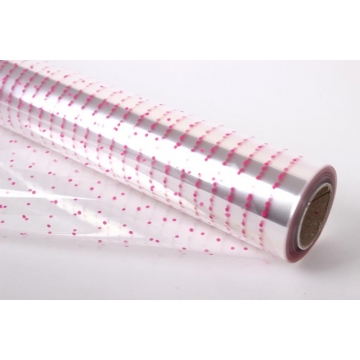 Transparentní celulózový celofán na roli s růžovým puntíkovým vzorem, 30 mikronů.